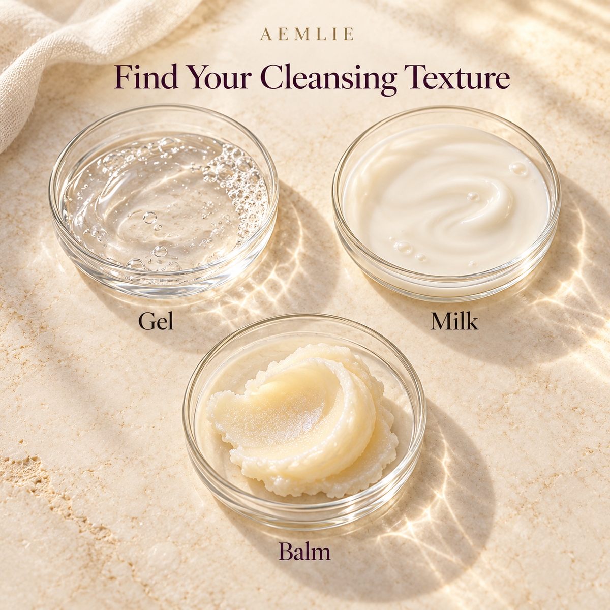 Aemlie: Three cleansing textures—clear gel, creamy milk and rich balm—in labelled glass dishes on ivory stone, beneath “Find Your Cleansing Texture